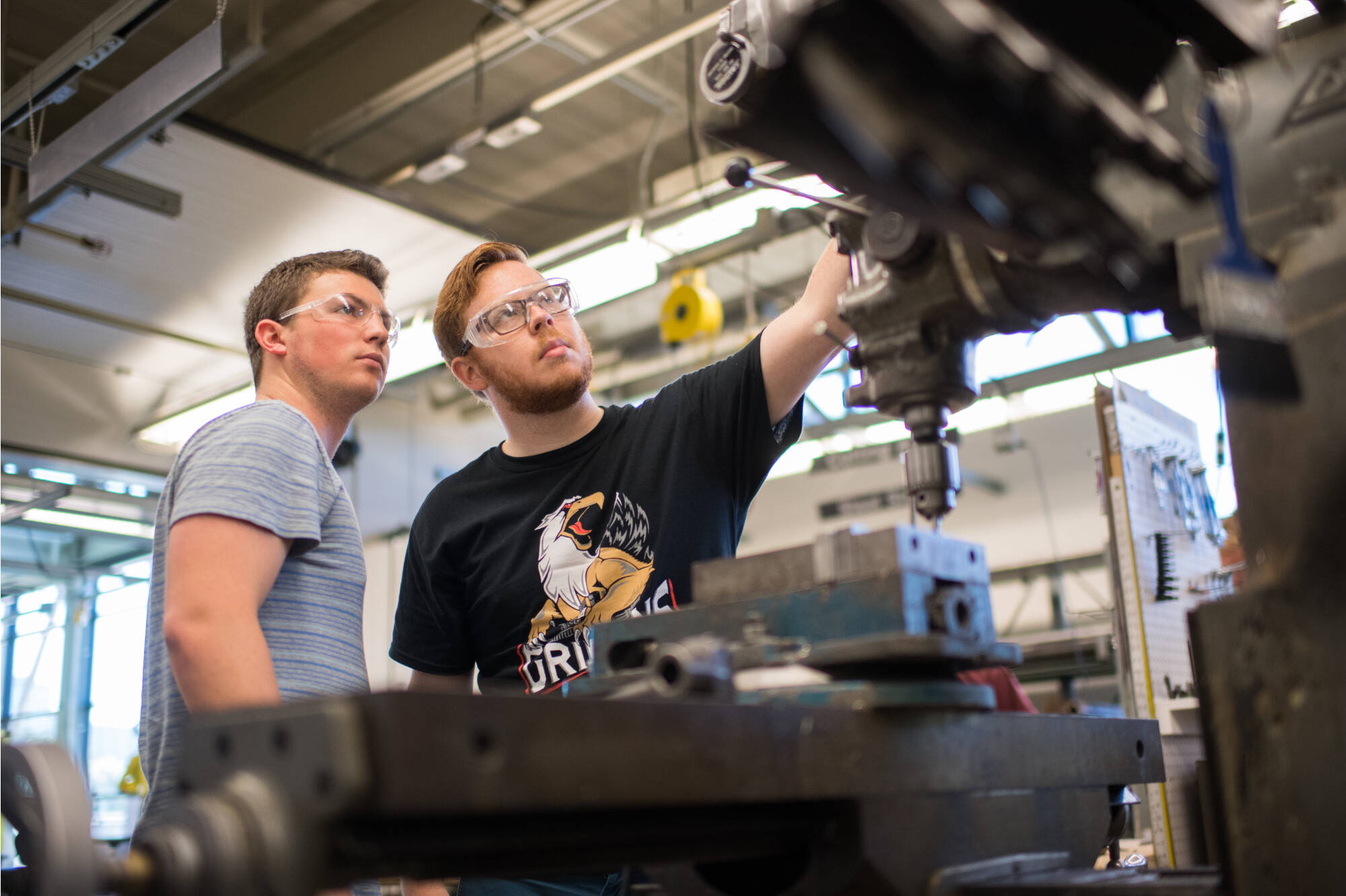 Two students in Keller machine shop